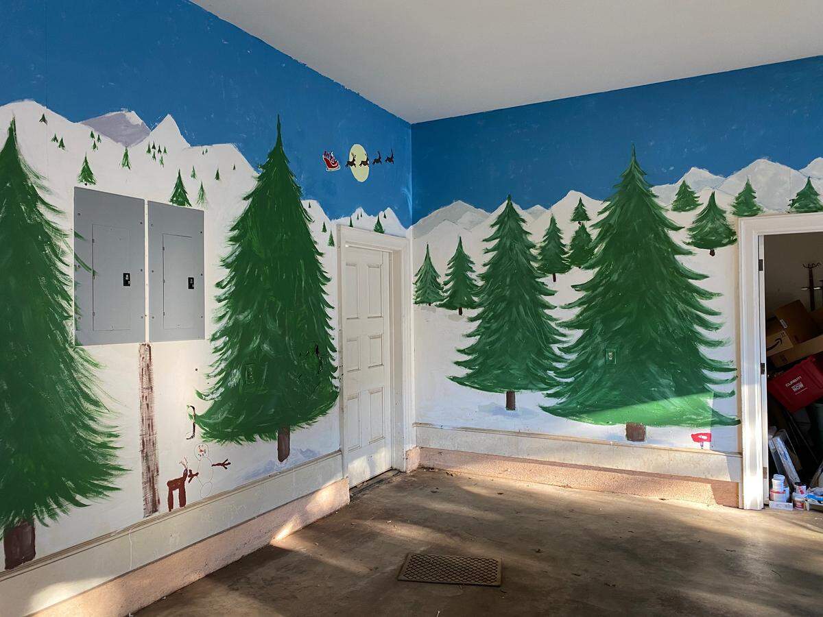Each member of the family participated in preparing the garage space for Christmas Day.