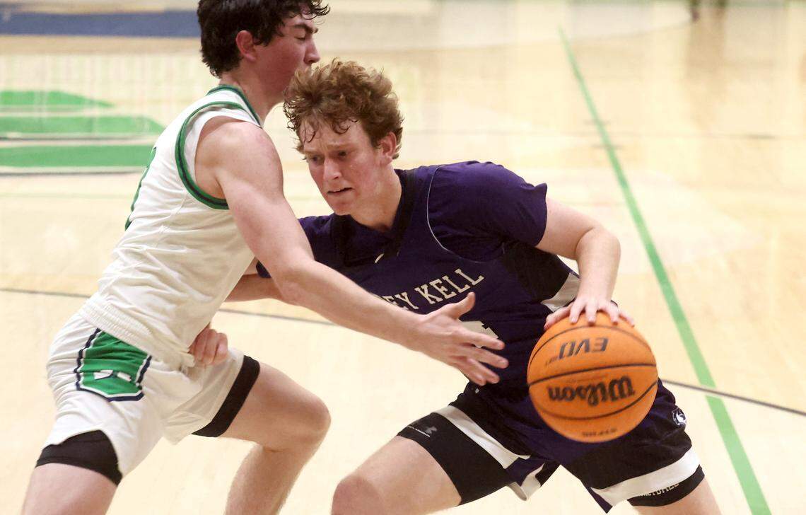 Ardrey Kell Knights Matthew Craft, right, drives to the basket against a Weddington Warriors defender during action on Tuesday, November 25, 2025 at Weddington High School. 