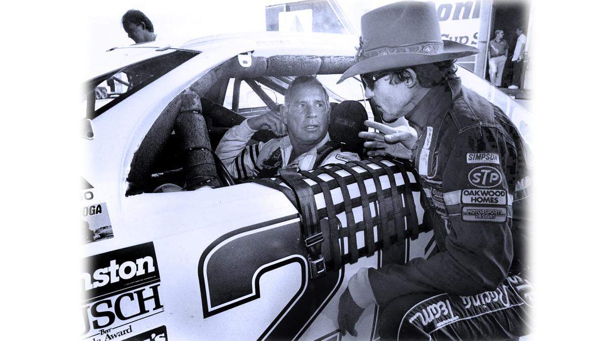 NASCAR icon David Pearson (left) with his longtime rival Richard Petty (right) at Charlotte Motor Speedway in 1989. Pearson passed away Monday night at the age of 83.