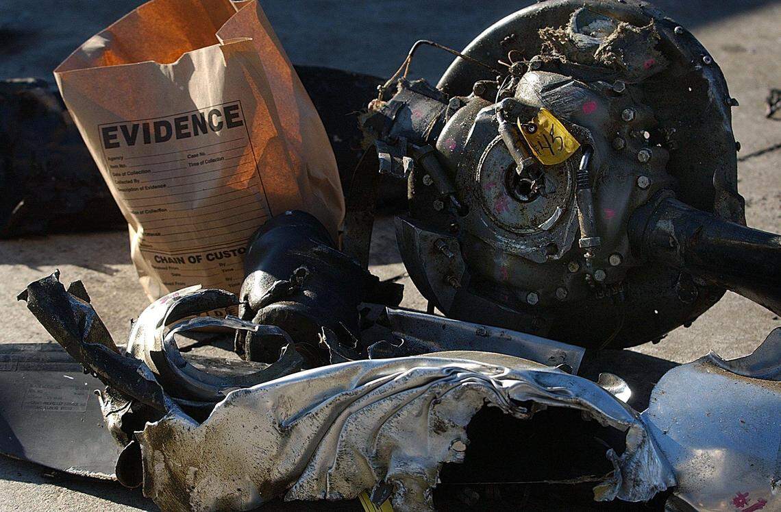 Photo from The Charlotte Observer on Jan. 10, 2003. Parts of the wreckage of US Airways Express Flight 5481 are tagged by investigators as evidence two days after the crash 20 years ago.