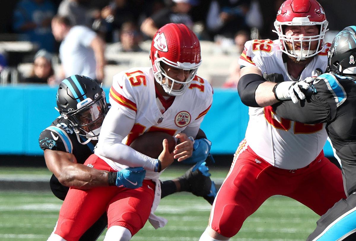 Carolina Panthers linebacker D.J. Wonnum, left, sacks Kansas City Chiefs quarterback Patrick Mahomes, right, at Bank of America Stadium in Charlotte, NC on Sunday, November 24, 2024.