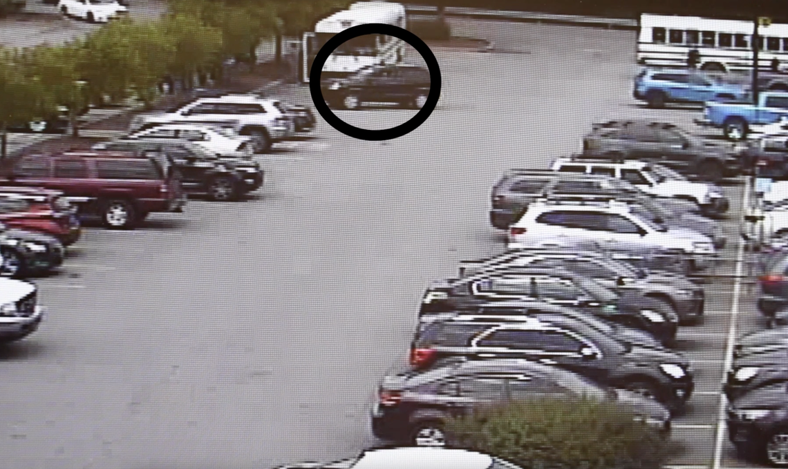 A screenshot from security footage that shows six migrant workers struck by SUV in what appears to be an intentional assault with a SUV vehicle at North Carolina Walmart, police say.