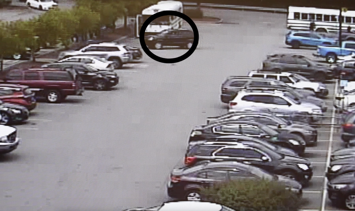 A screenshot from security footage that shows six migrant workers struck by SUV in what appears to be an intentional assault with a SUV vehicle at North Carolina Walmart, police say.