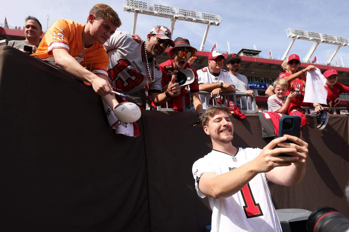 YouTuber and North Carolina native Jimmy Donaldson, also known as “MrBeast,” with fans before a football game at Raymond James Stadium.