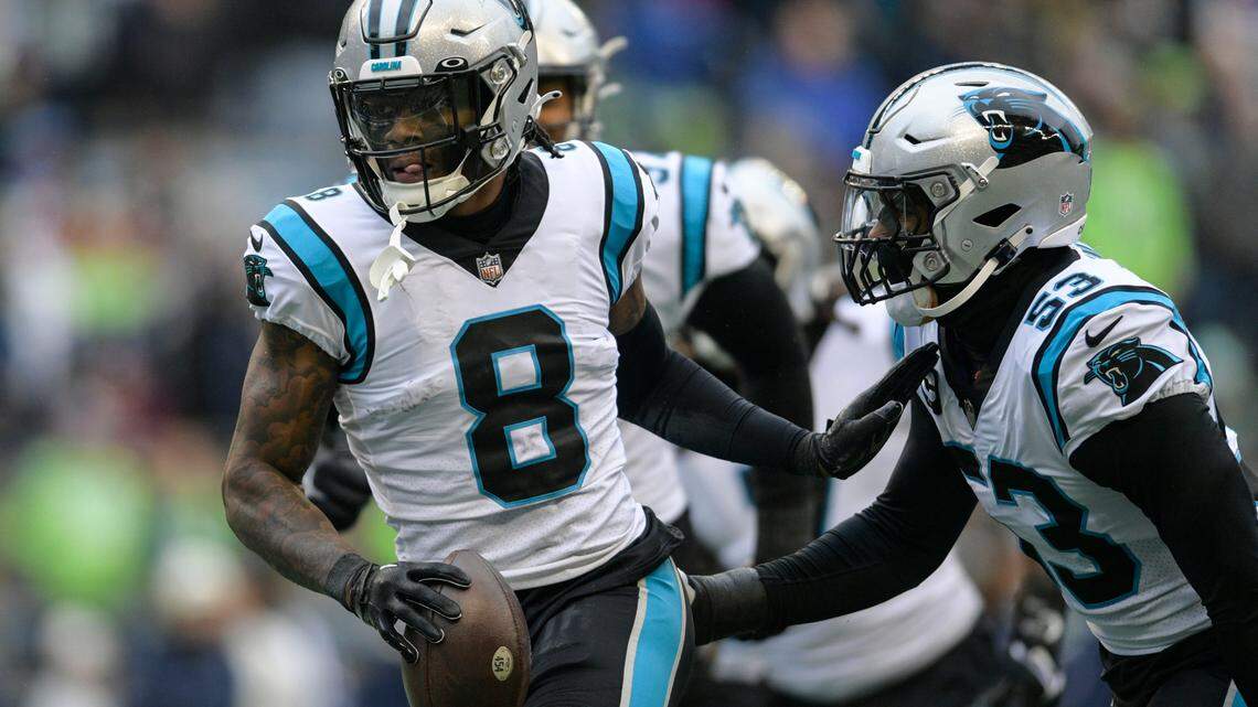 Carolina Panthers cornerback Jaycee Horn (8) celebrates his touchdown against the Seattle Seahawks during the first half of an NFL football game, Sunday, Dec. 11, 2022, in Seattle. (AP Photo/Caean Couto)