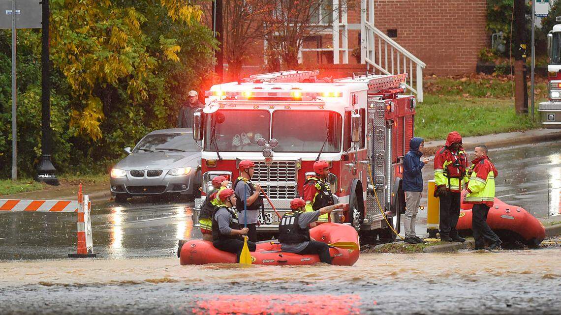 Charlotte Fire water rescue team members stage on West Blvd. during a heavy rain in Charlotte, NC on Thursday, November 12, 2020.