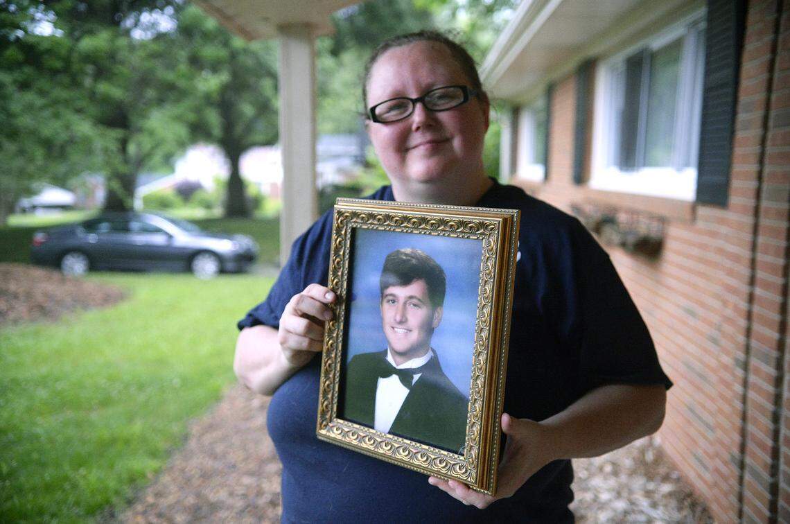 Beth Allen holds a photo of her late son, Christian Allen, an East Mecklenburg high school student who was shot to death at a party in 2017.