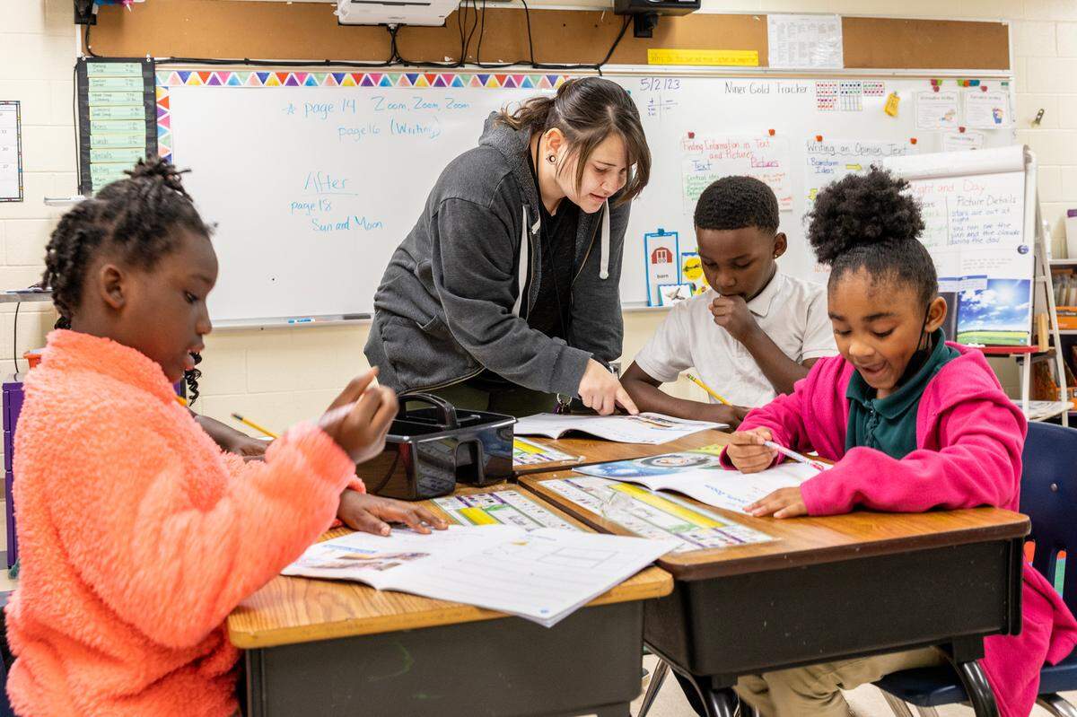 Jessica Caro, an arts teacher, works with students at Niner University Elementary, a lab school with the University of North Carolina Charlotte’s Cato College of Education.