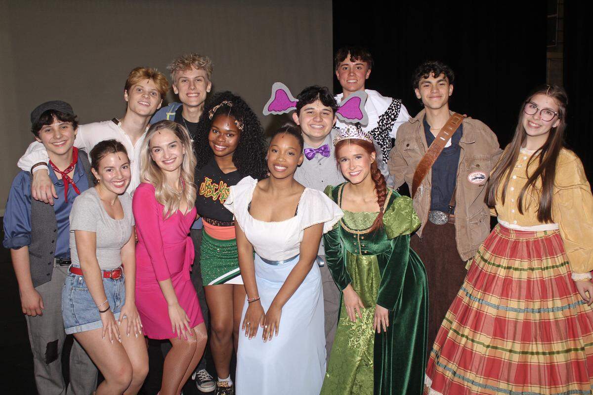 Blumey Awards Best Actor and Best Actress Nominees rehearsing in costume and mics for the first time on the Belk Theater stage. Best Actor winner Harold Garcia is second from right (brown strap) and Best Actress winner Anna Jernigan is second from left (gray top).