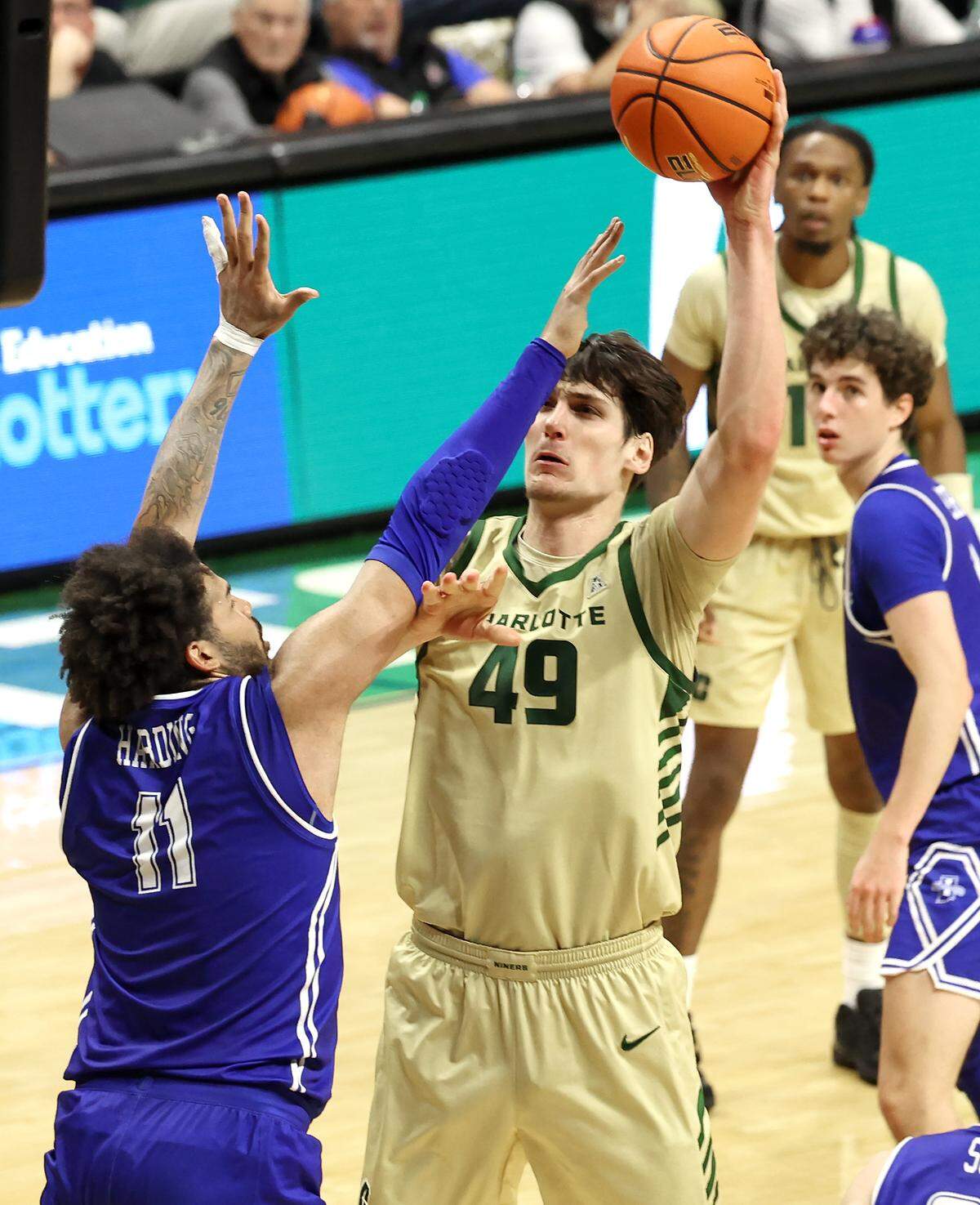 Charlotte 49ers center Anton Bonke, right, releases a one-handed shot over Indiana State center Markus Harding, left, during action on Monday, November 3, 2025 at Halton Arena.