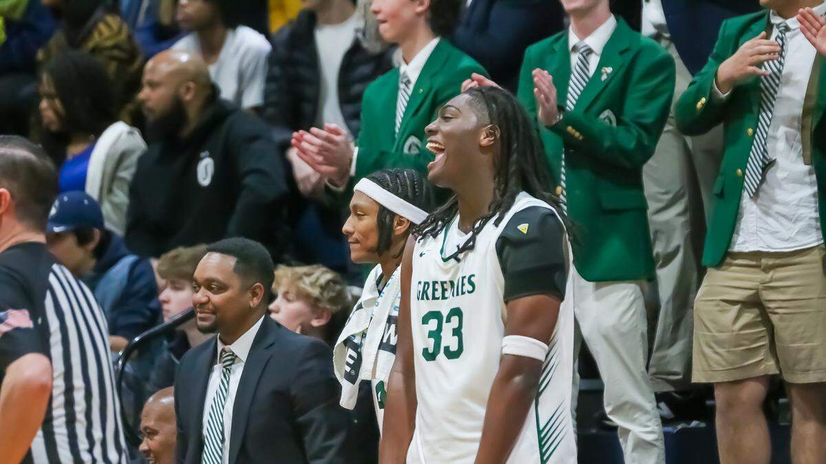 Christ School players celebrate with their fans after the game at NCISAA state finals at Providence Day on February 22, 2025 in Charlotte, NC