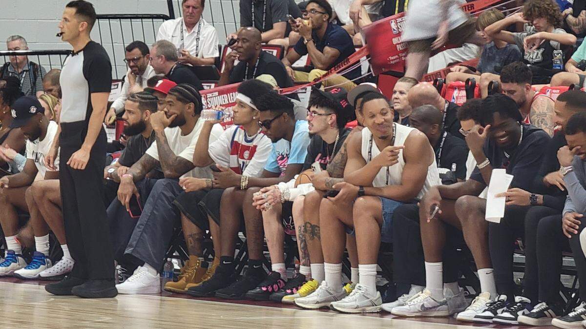 Several members of the Charlotte Hornets sit courtside to watch NBA summer league action at Cox Pavilion on July 16, 2024.