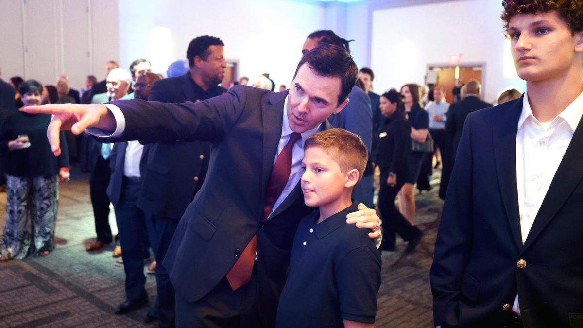 U.S. Rep. Jeff Jackson watches returns come in with his son Owen during a North Carolina Democratic Party election night event at the Marriott City Center in Raleigh, N.C., Tuesday, Nov. 5, 2024.