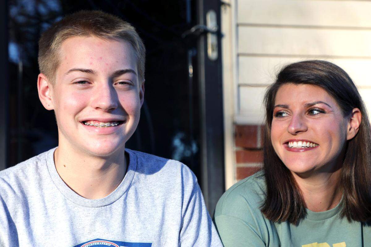 Kristin Padgett, right, with her son Foster, also has an 8-year-old and a 4-year-old, and says, “Whenever they turn 14, I could have each of them run a marathon with me and train for a marathon!”