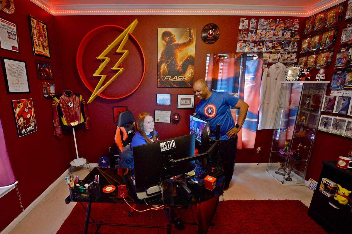 Cubby and Jor-El in Cubby’s office, which has a The Flash theme throughout.
