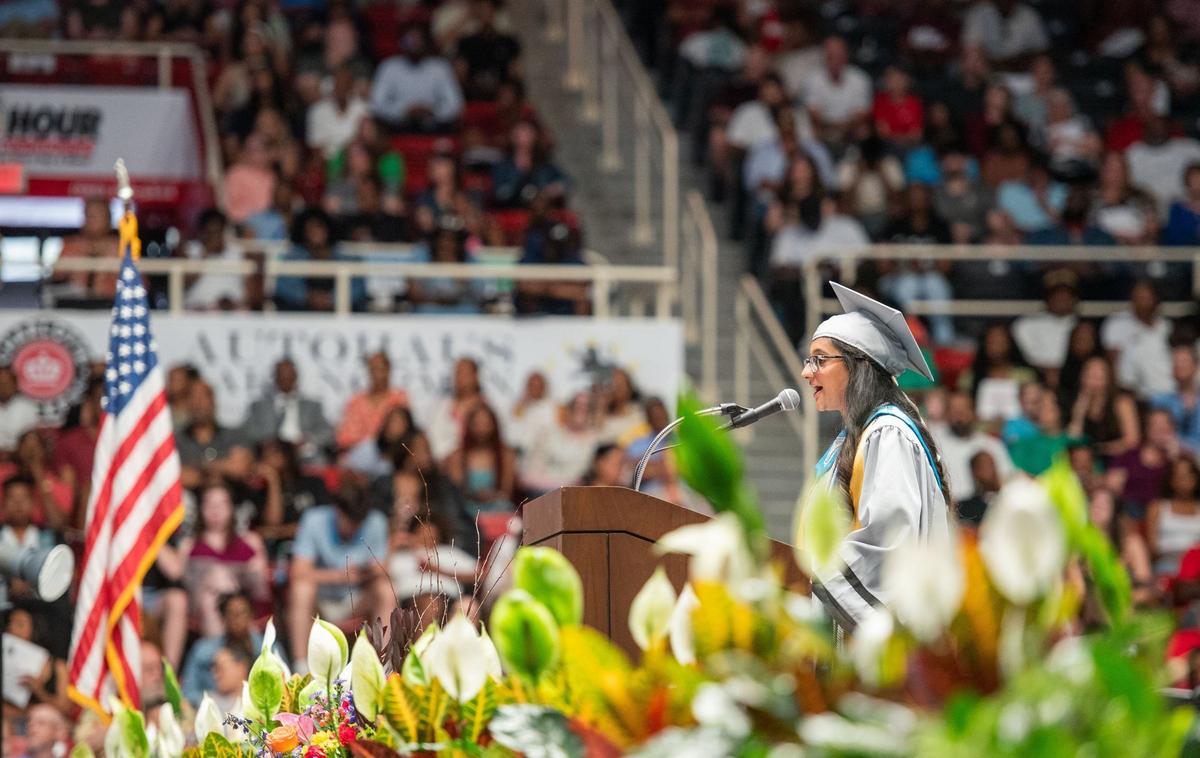 A David W. Butler High School graduate speaks to their fellow graduates during the graduation ceremony at the Bojangles Coliseum in Charlotte on Monday, June 10, 2024.