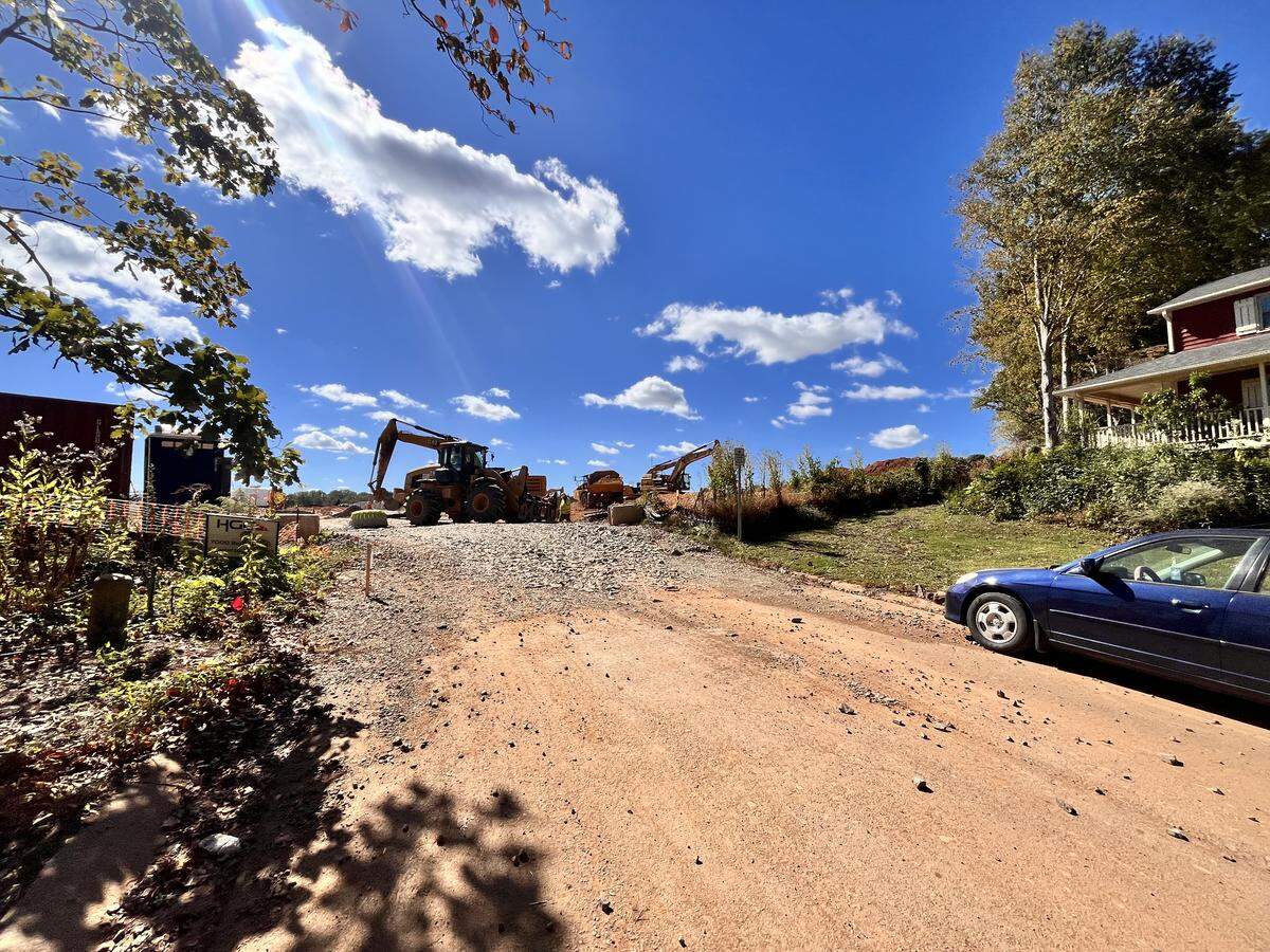 Outside Tyler Smith’s home in Autumnwood in northeast Charlotte. Near his home, the Blankenship development is under construction, which will add more than 600 homes to the area. Smith said the construction site has impacted his life.