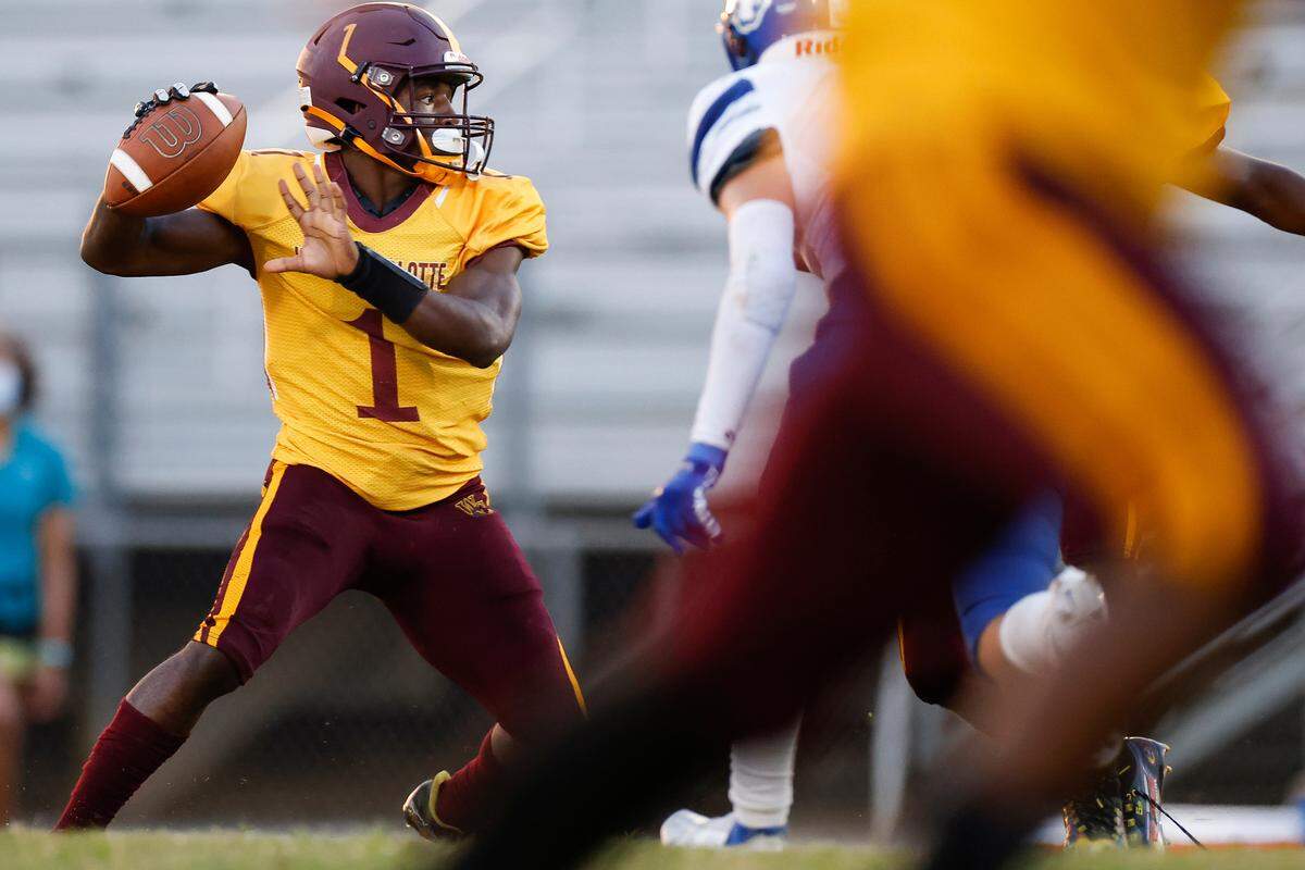 West Charlotte’s Caleb Barringer (1) passes the ball during a game against Garinger at Waddell High School in Charlotte, N.C., Thursday, Sept. 8, 2022. West Charlotte beat Garinger 48-8.