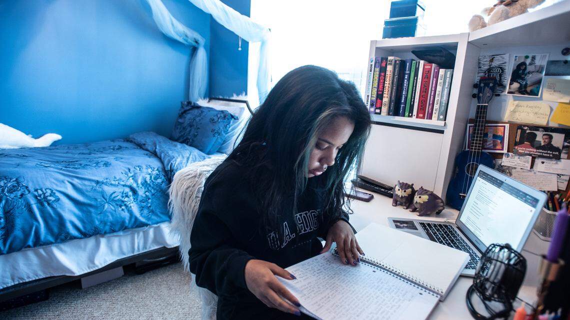 Jaylen Adams works on schoolwork in her bedroom in Charlotte, NC, on Monday, March 29, 2021.