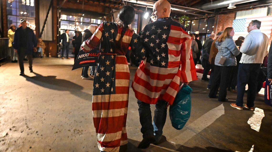 Dressed in a flag wardrobe, Maddison Saliba, left and her father, Matthew Saliba arrive at Norfolk Hall at Suffolk Punch in SouthEnd for a Nikki Haley rally on Friday, March 1, 2024.