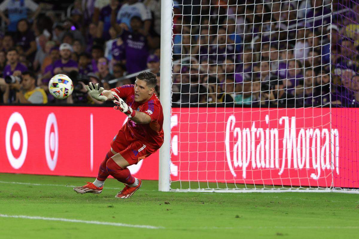 Nov 9, 2024; Orlando, Florida, USA; Charlotte FC goalkeeper Kristijan Kahlina (1) dives for the ball in the first half against the Orlando City in a 2024 MLS Cup Playoffs Round One match at Inter&Co Stadium. Mandatory Credit: Mike Watters-Imagn Images