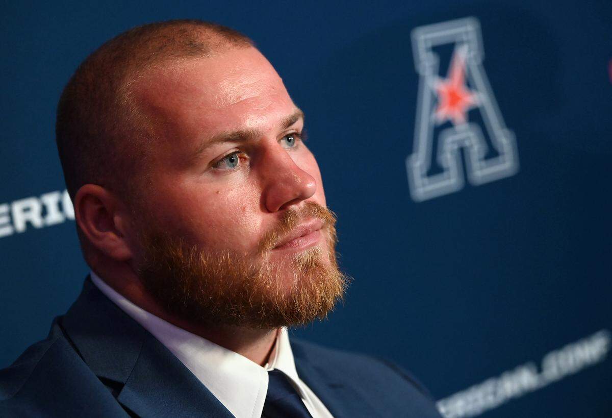 Charlotte 49ers offensive lineman Jonny King listens to a question during Friday’s American media day at the Charlotte Convention Center.