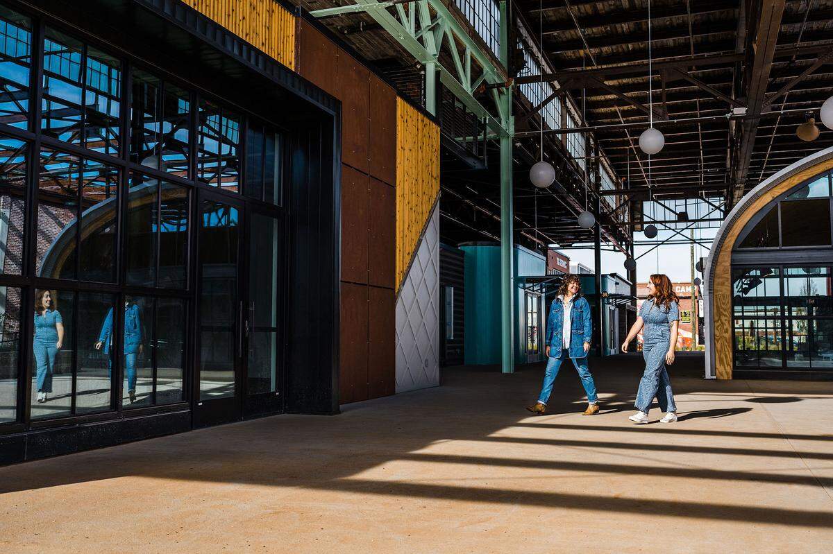 Rachel Hopkins, owner of Room Service, and Jules Zanoni, owner of Stay Inn, will open the two new interconnected spots at Camp North End in Spring 2023.