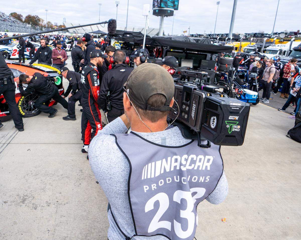 As Ross Chastain confers with his team pre-race, videographers and audio engineers for NASCAR’s ambitious Race For The Championship documentary try to not miss a moment.