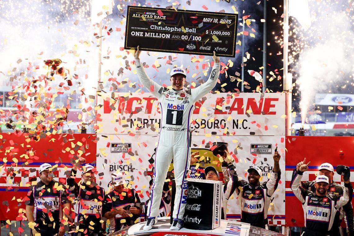 May 18, 2025; North Wilkesboro, North Carolina, USA; NASCAR Cup Series driver Christopher Bell (20) celebrates winning the NASCAR All-Star Race at North Wilkesboro Speedway.