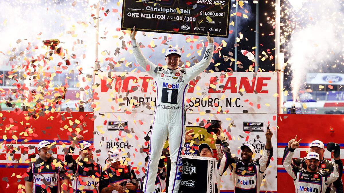 May 18, 2025; North Wilkesboro, North Carolina, USA; NASCAR Cup Series driver Christopher Bell (20) celebrates winning the NASCAR All-Star Race at North Wilkesboro Speedway.