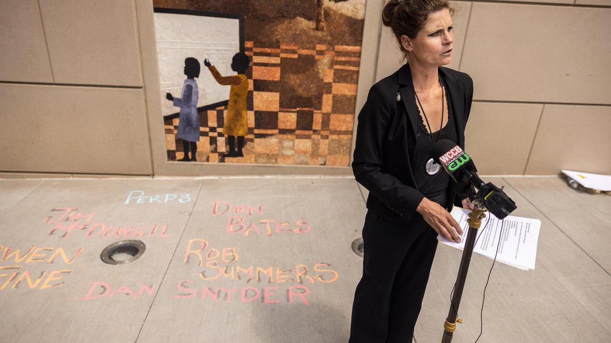 Letta cartlige speaks outside of the Charles R. Jonas courthouse in Charlotte on Monday. Clergy sex abuse victims and advocates disclosed that a Charlotte judge has just tossed out a civil suit against a Charlotte-based Protestant religious group.