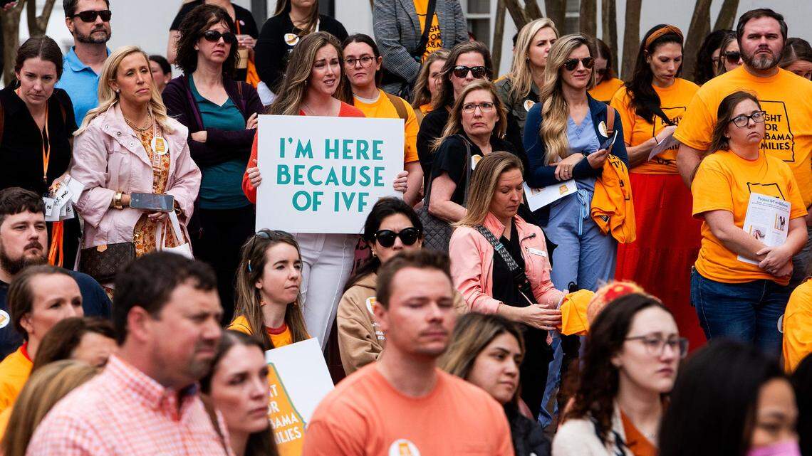 Sarah Brown holds a sign in the crowd during a protest rally for in vitro fertilization legislation at the Alabama Statehouse in Montgomery, Ala., on Feb. 28, 2024.