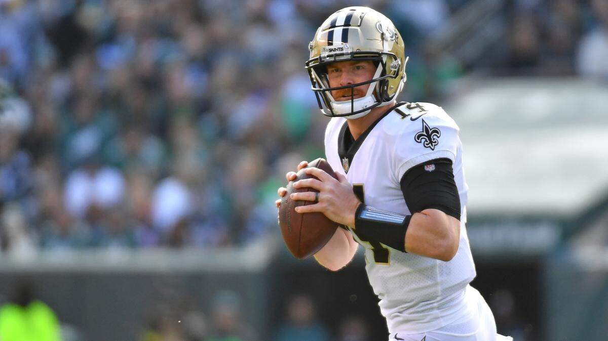 New Orleans Saints quarterback Andy Dalton (14) looks for a receiver against the Philadelphia Eagles at Lincoln Financial Field.