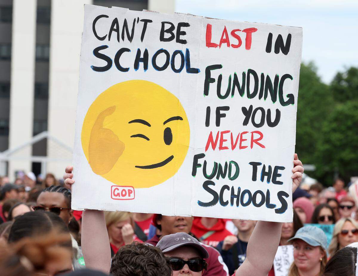 Signs, signs, signs were everywhere as teachers rallied at the Government Complex in Raleigh.