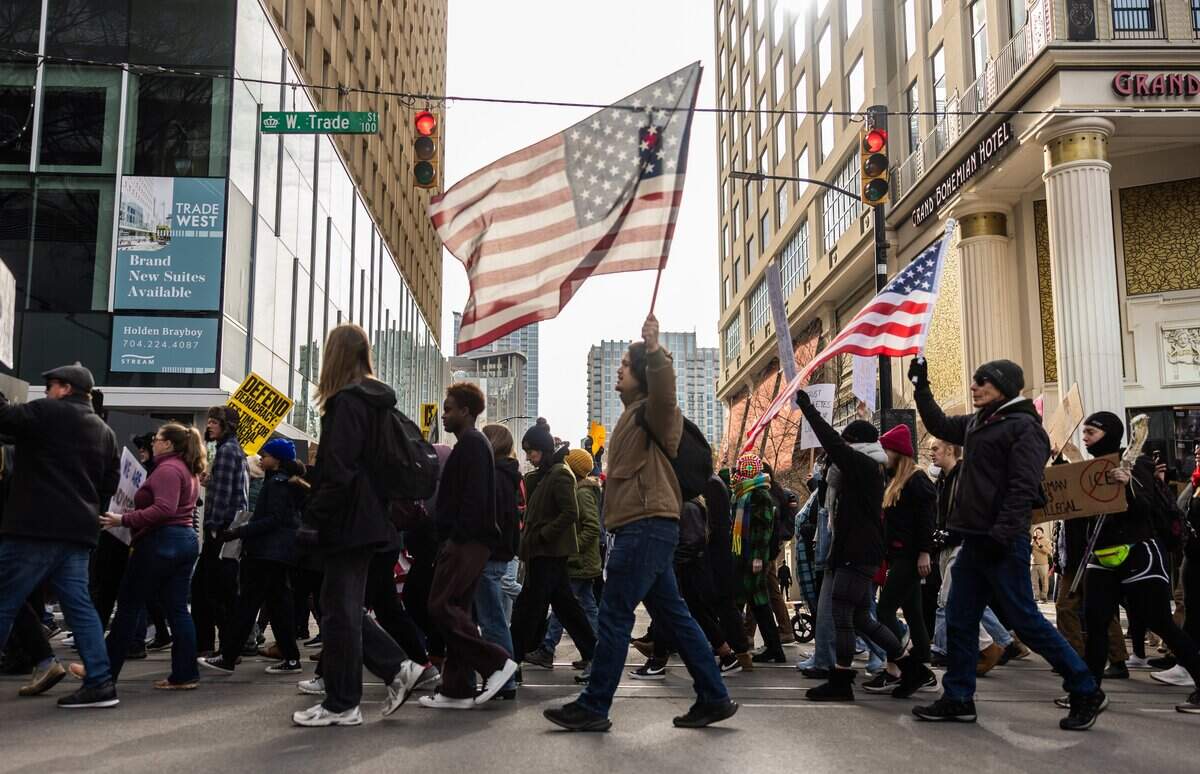 Protesters march during the ICE OUT Charlotte: Stand with Minnesota Rally in Charlotte, N.C., on Friday, January 30, 2026.