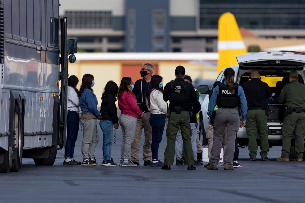 A large group of Guatemalan women are checked before they board a plane to be deported to Guatemala under Title 8 by ICE field office and U.S. Department of Homeland Security personnel on Friday, June 2, 2023.