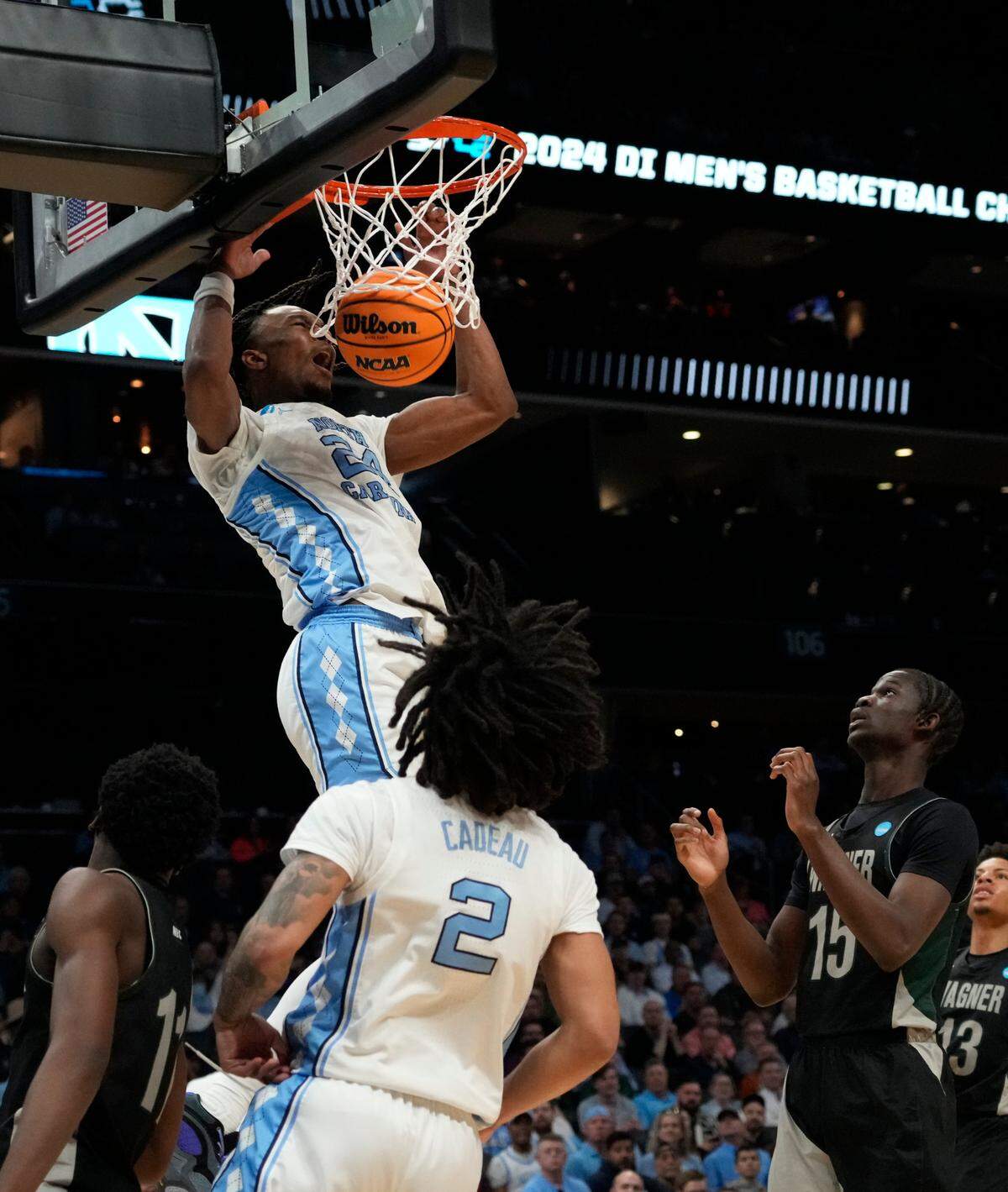 North Carolina Tar Heels forward Jae’Lyn Withers, a former North Meck standout, dunks against the Wagner Seahawks on Friday at Spectrum Center. / Jim Dedmon-USA TODAY Sports