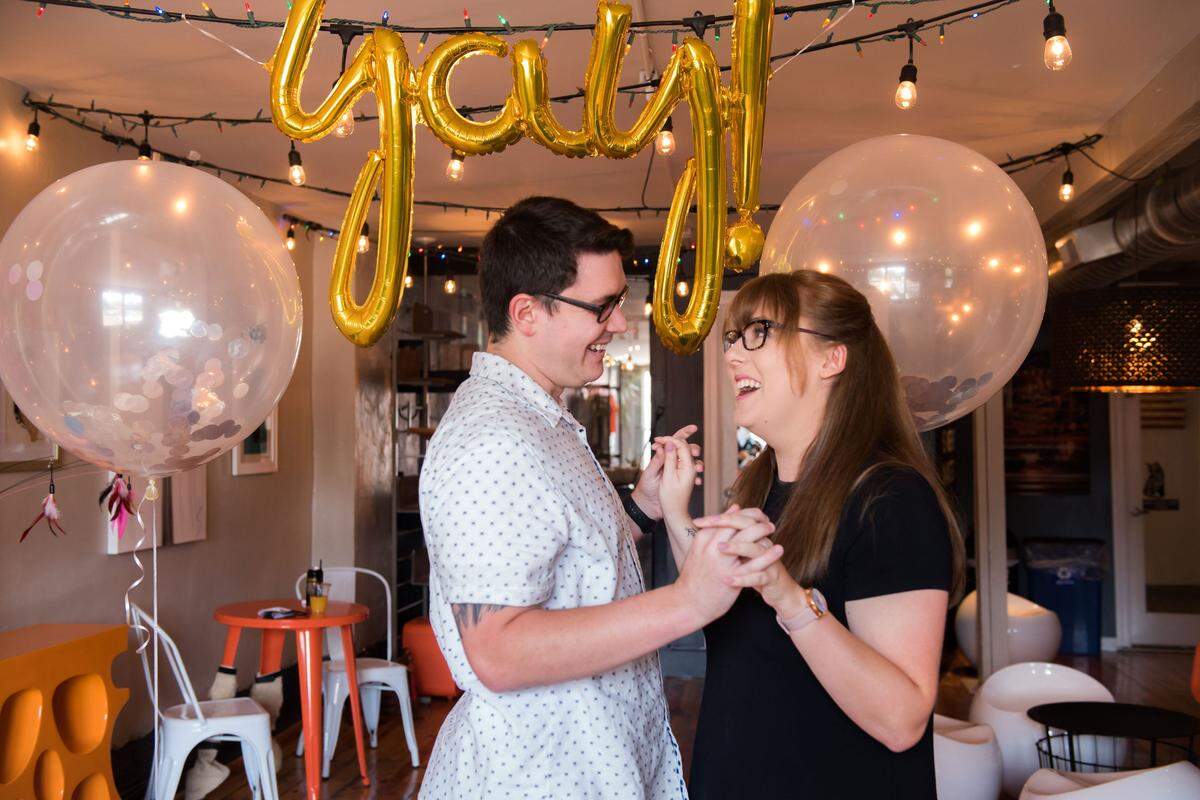 Newly engaged teachers Sean Pitchford and Leanne Gardner share a love of cats.