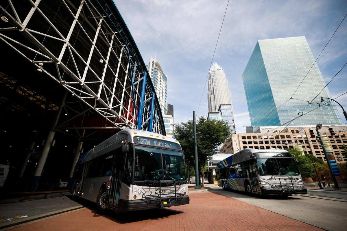 Two CATS busses leave the Charlotte Transportation Center on East Trade Street in Charlotte, N.C., Tuesday, July 12, 2022. CATS is currently facing a bus driver shortage which has been affecting commuters.