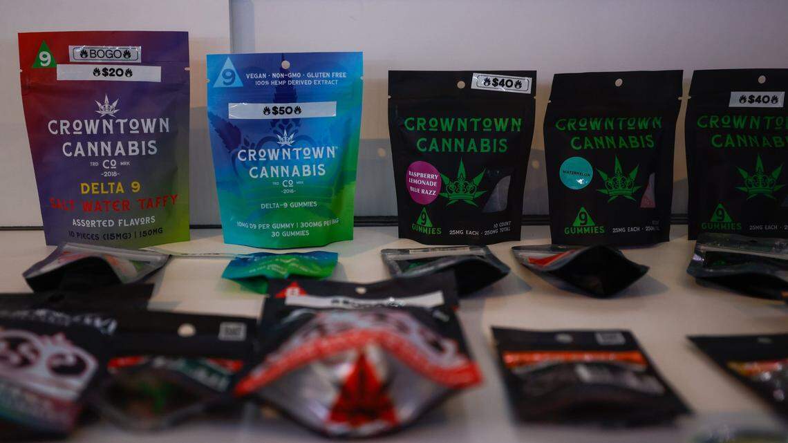 Delta-9 gummies line the inside of a display case inside Crowntown Cannabis on North Davidson Street on Tuesday, April 9, 2024.