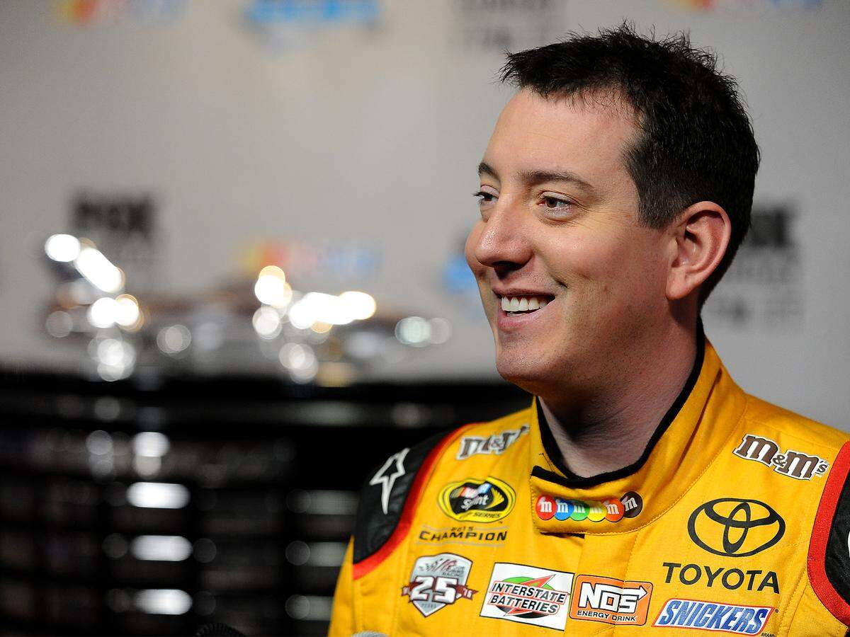 NASCAR Sprint Cup Series driver Kyle Busch smiles as he listens to a reporter's question during the NASCAR Media Day at Daytona International Speedway on Tuesday, February 16, 2016. 