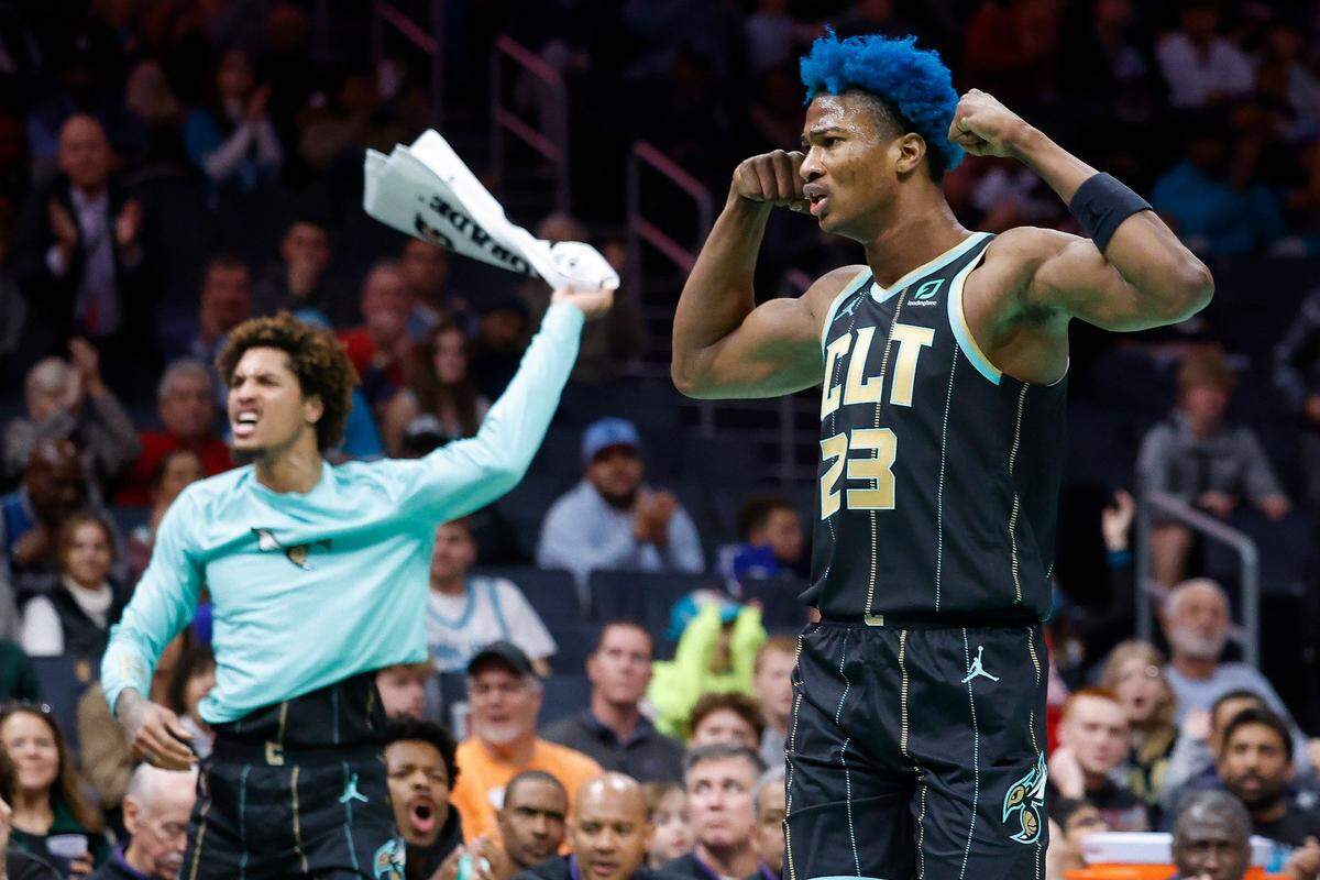 Charlotte Hornets guard Kelly Oubre Jr. (12) and Charlotte Hornets forward Kai Jones (23) celebrate during a game against the Minnesota Timberwolves at Spectrum Center in Charlotte, N.C., Friday, Nov. 25, 2022.