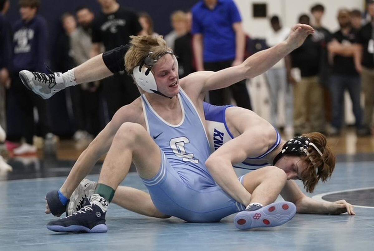 Charlotte Latin's Davis Jones, left, breaks out of a hold from Charlotte Christian's Harrison Landon during their 132-pound championship match Saturday at the N.C. Independent Schools Athletic Association's state championships in Charlotte. 