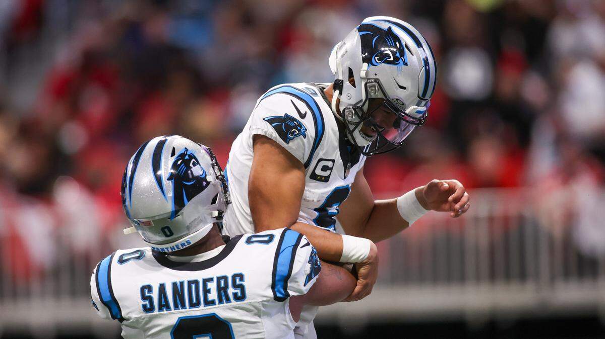Jan 5, 2025; Atlanta, Georgia, USA; Carolina Panthers quarterback Bryce Young (9) celebrates with tight end Ja’Tavion Sanders (0) after a touchdown run against the Atlanta Falcons in the second quarter at Mercedes-Benz Stadium. Mandatory Credit: Brett Davis-Imagn Images