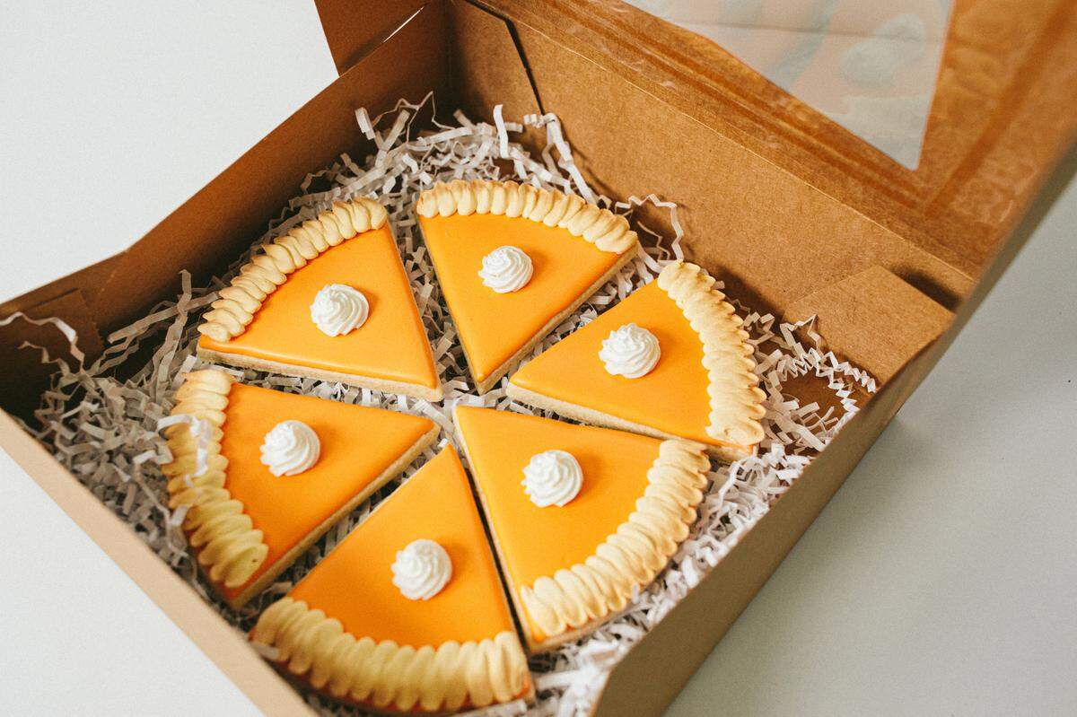 Stunning cookies shaped like pumpkin pie slices make for a memorable Thanksgiving treat.