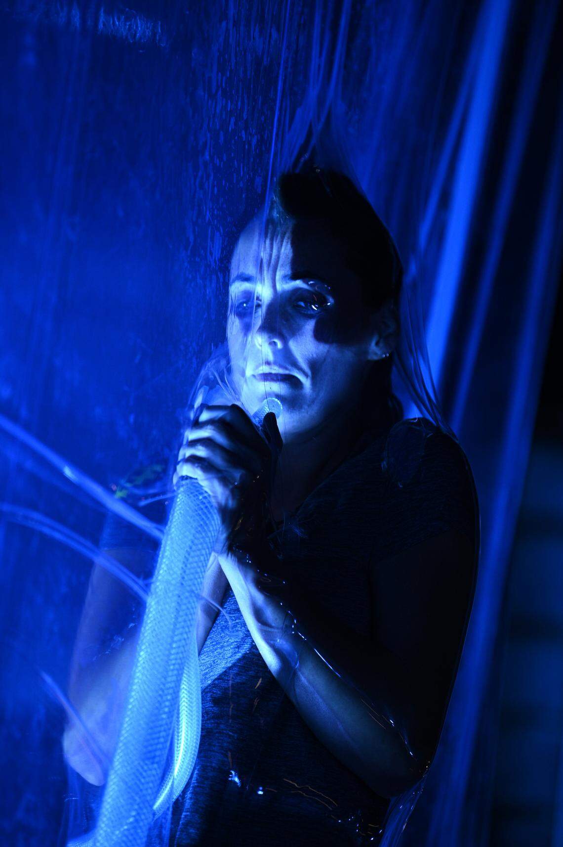 Tyler White of Denver, N.C., finds herself encased in plastic shrink wrap during Wednesday night’s premiere episode of “Fear Factor: House of Fear.”