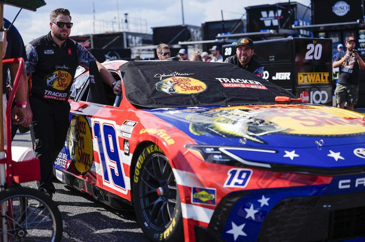 NASCAR Cup Series driver Chase Briscoe (19) team pushes his car out of the garage area during the Cookouts Southern 500 at Darlington Raceway on Sunday.