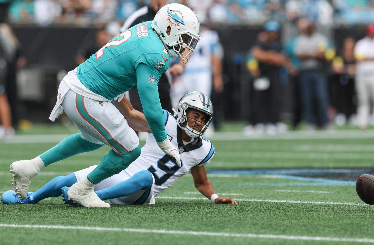 Panthers quarterback Bryce Young loses control of the ball as Dolphins linebacker Bradley Chubb gets close during the game at Bank of America Stadium in Charlotte on Sunday, October 5, 2025