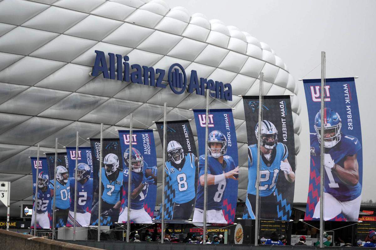 Banners of New York Giants and Carolina Panthers players during the 2024 NFL Munich Game at Allianz Arena. Kirby Lee-Imagn Images