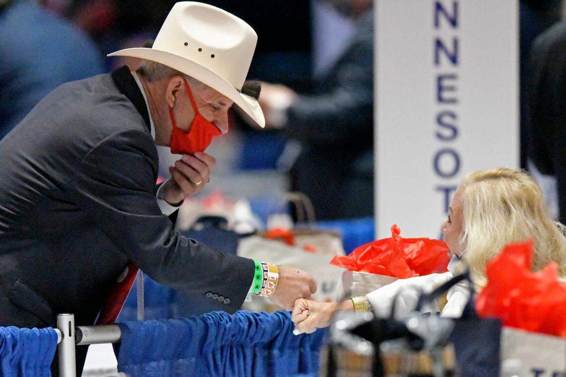 Republican National Convention delegates greet each other at the Charlotte Convention Center in Charlotte, N.C., Monday August, 24, 2020. The GOP convention was scaled back this year because of the coronavirus pandemic.